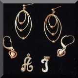 J03. Gold pendants and earrings. 